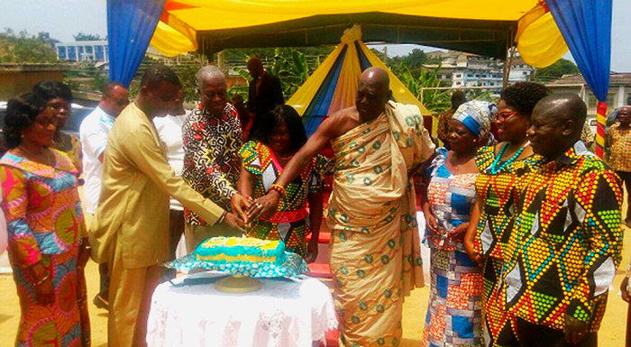 Vice-President Amissah-Arthur (3rd left) being assisted by Mr Rickets Hagan (left) and Osaberima Kwesi Atta II, Omanhen of the Oguaa Traditional Area, to cut the anniversary cake at the function